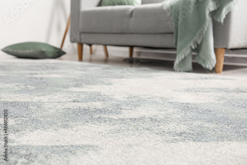 Obraz na plátně Stylish soft carpet in room interior
