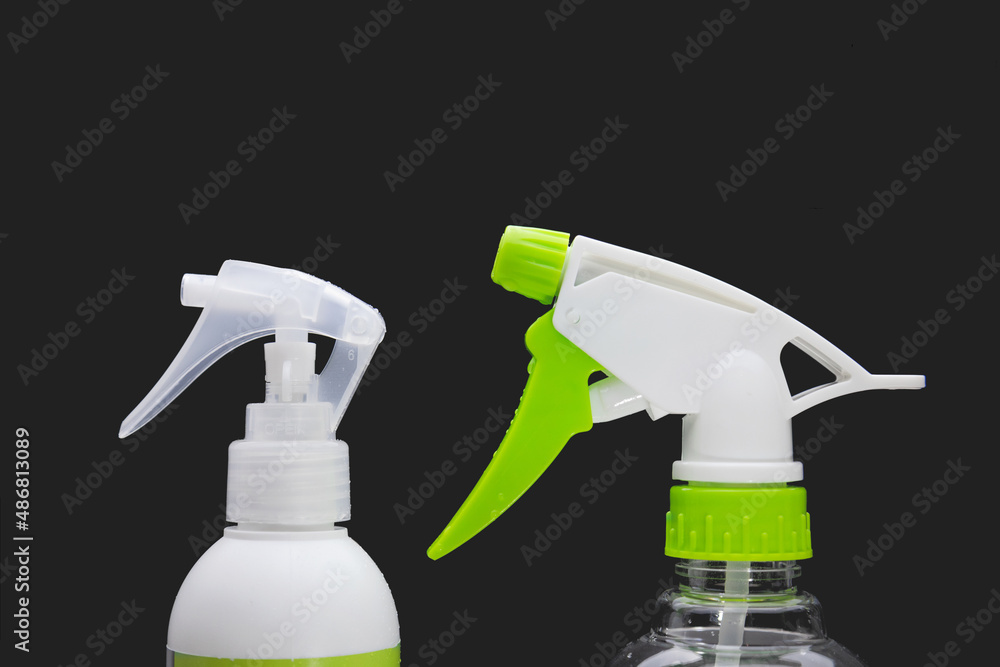 Sprayers for antiseptic on a black background Sprayers for antiseptic on a black background