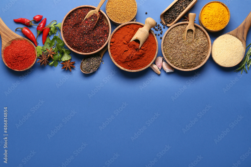 Set of aromatic spices on blue background Set of aromatic spices on blue background