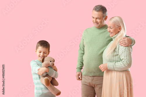 Little boy with toy and his...