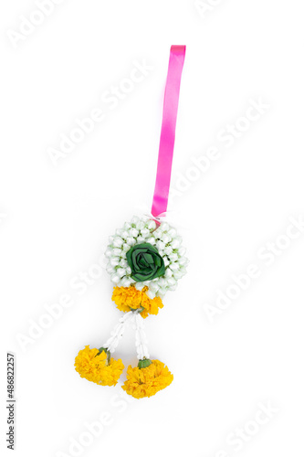 Fresh flower garland Jasmine, Tagetes erecta,Calotropis,Pandanus amaryllifolius ribbon for hanging isolated on white background.