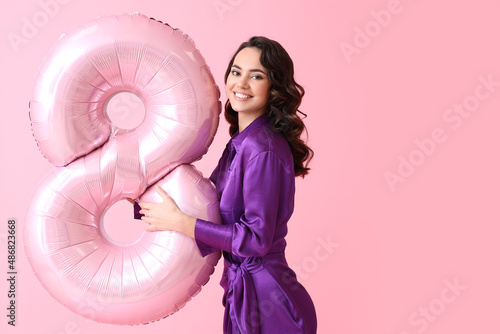 Smiling young woman with bi...