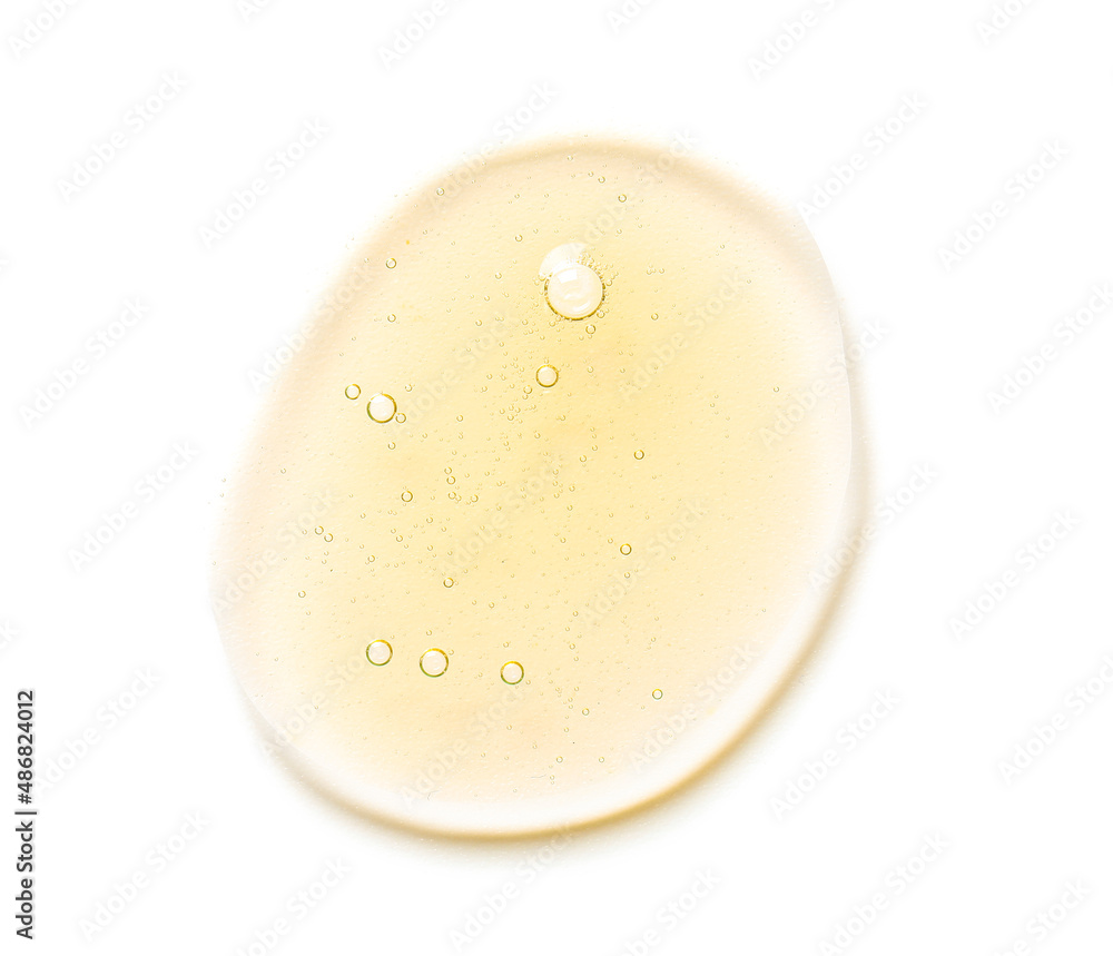 Drop of cosmetic serum on white background