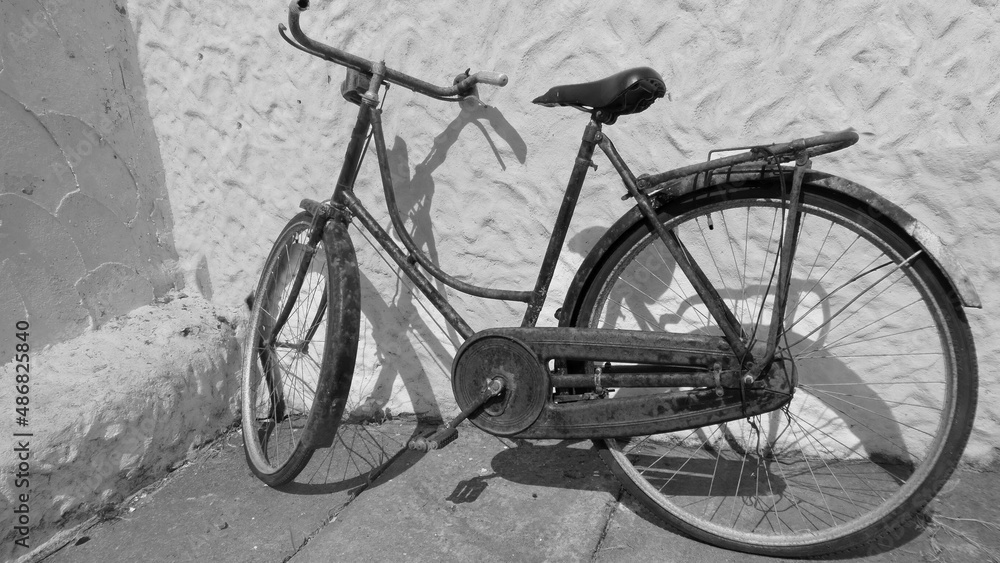 Old antique bicycle sitting up against a irish cottage Old antique bicycle sitting up against a irish cottage