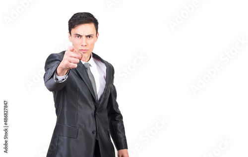 Serious confident businessman in classy outfit pointing at camera