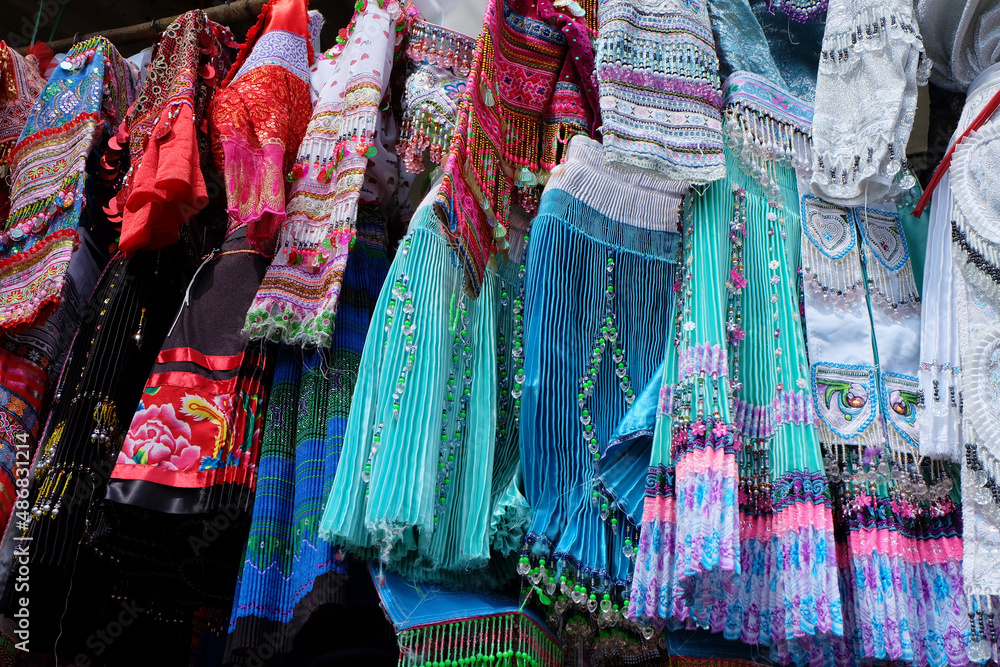 Close up photo of traditional skirts and dresses of Ethnic Minority, hanging to sell in Sapa Market, Vietnam