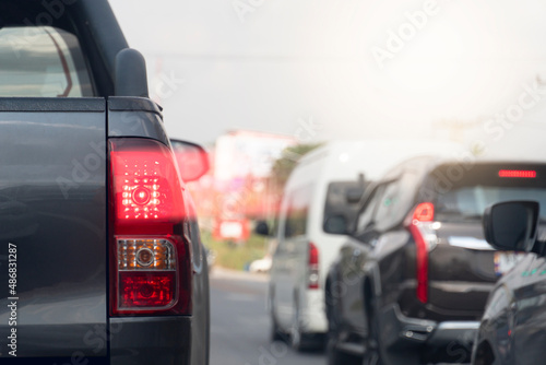 Abstract of car rear lights from brake. Cars parked close to each other during traffic jams.