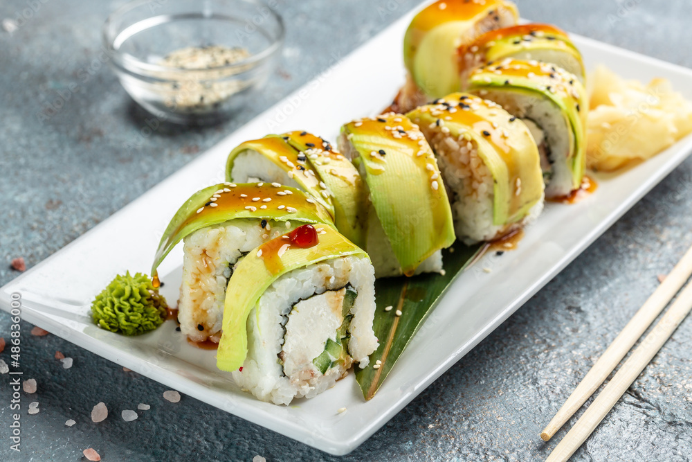 Sushi rolls with avocado and cream cheese, vegetarian sushi roll, ushi