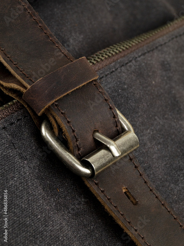 Elements on the leather product: belts, fasteners, fasteners, zippers. Close-up image