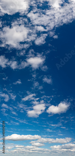 Fantastic clouds against blue sky, panorama