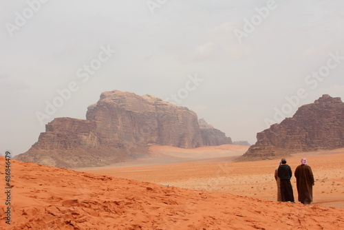 men walking in desert