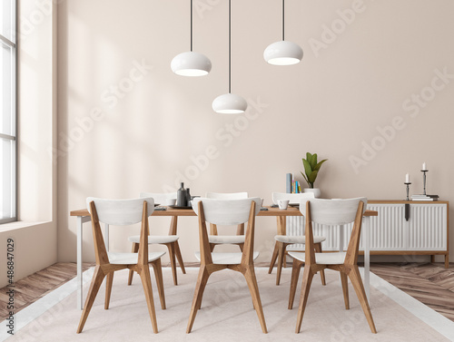 Light eating interior with seats, drawer and table near window © ImageFlow