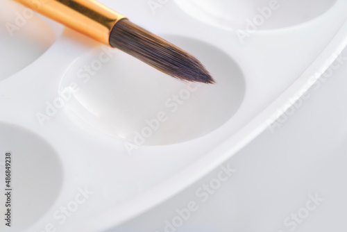 brush for drawing with water colors on white background, copy space