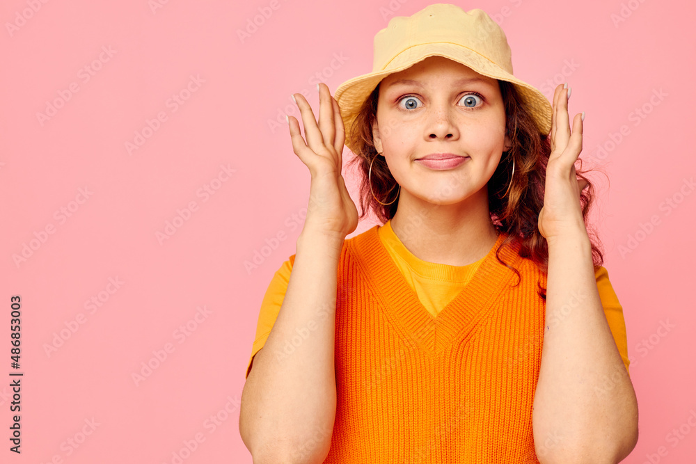 pretty girl in yellow hat fashion posing emotions cropped view unaltered pretty girl in yellow hat fashion posing emotions cropped view unaltered
