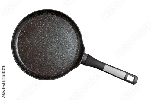 Black pancake pan with nonstick surface isolated on white background, close-up, top view.