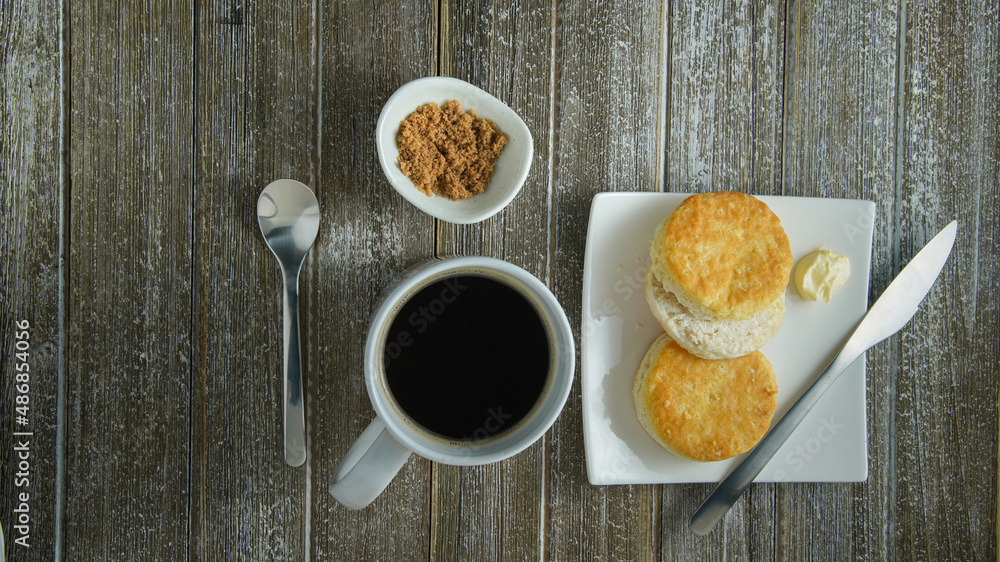 Slices of biscuits with butter. Hot Coffee with brown sugar Slices of biscuits with butter. Hot Coffee with brown sugar