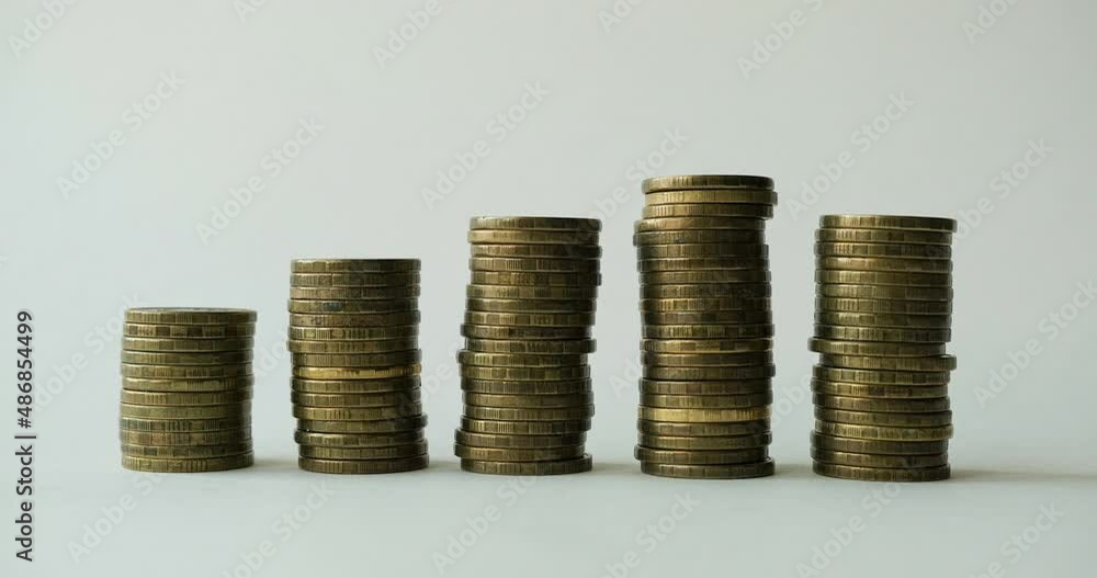 Gold towers made out of gold coins. Stop motion animation Gold towers made out of gold coins. Stop motion animation