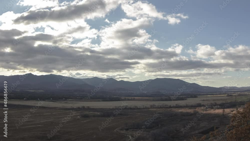 The sun is breaking through the clouds over a yellowed field. Timelapse. Autumn. The sun is breaking through the clouds over a yellowed field. Timelapse. Autumn.