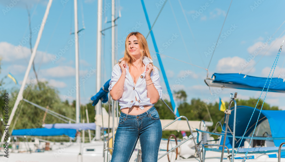 Attractive woman in yacht club, sunny warm day. Relax and freedom concept 
