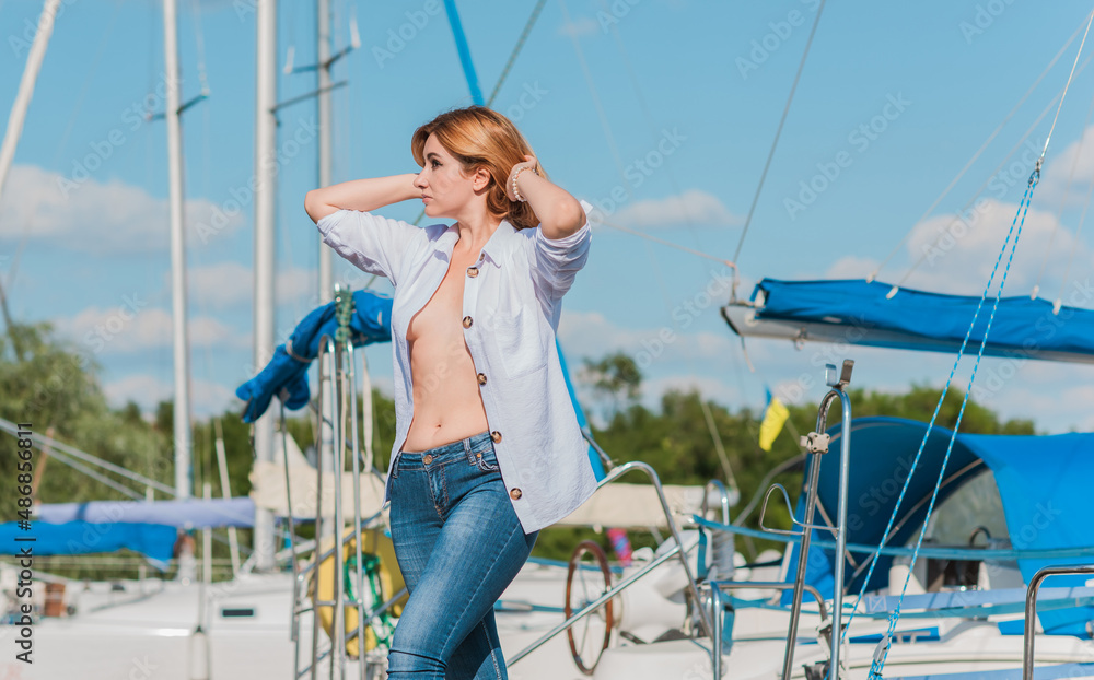 Attractive woman in yacht club, sunny warm day. Relax and freedom concept Attractive woman in yacht club, sunny warm day. Relax and freedom concept