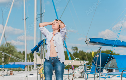Attractive woman in yacht club, sunny warm day. Relax and freedom concept  © T.Den_Team