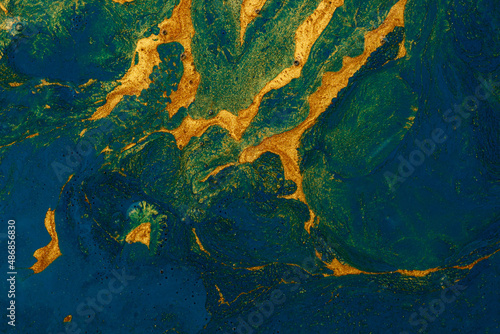 Abstract background. Swirls of marble. Natural Luxury. Gold and blue paint background