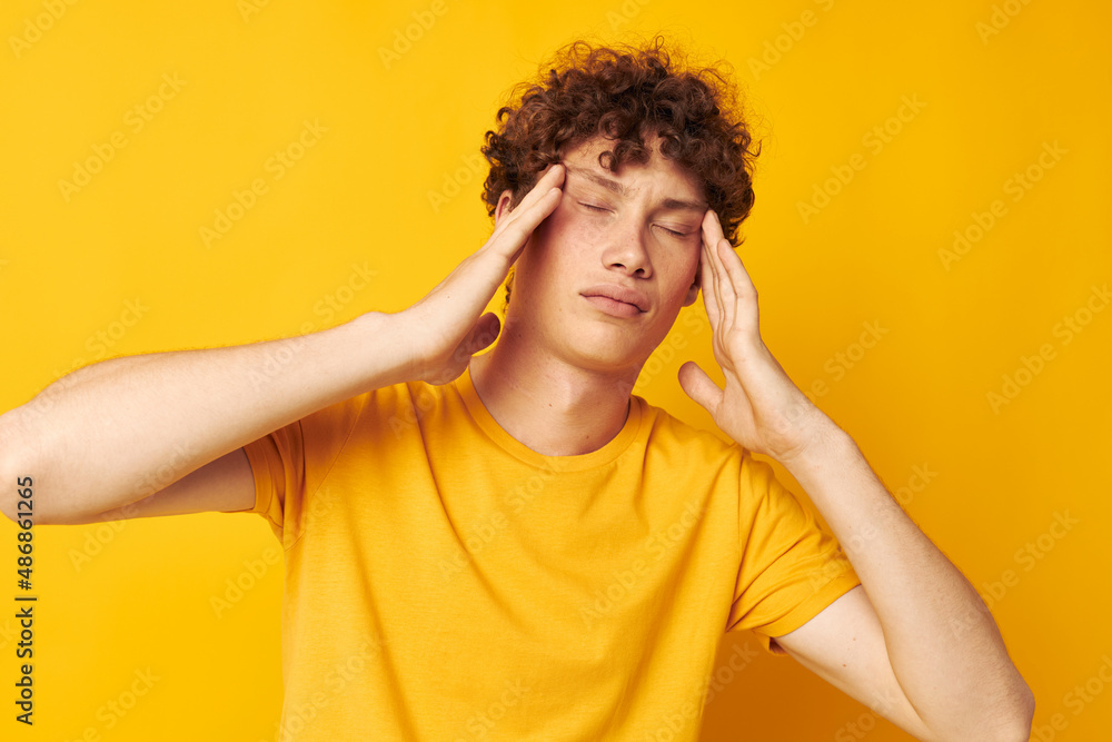 portrait of a young curly man Youth style studio casual wear isolated background unaltered portrait of a young curly man Youth style studio casual wear isolated background unaltered