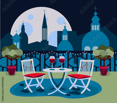 Cozy restaurant on rooftop with table and two chair in the old city Rome with the cityscape evening or night