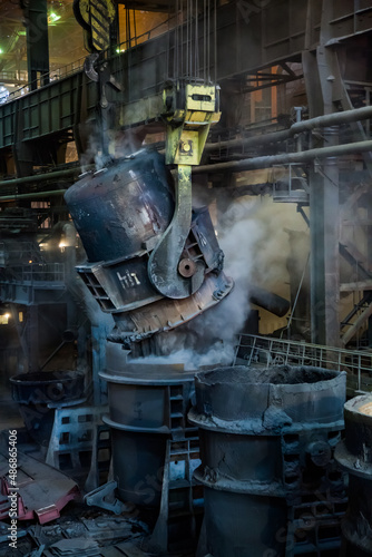 Temirtau, Kazakhstan - June 08, 2012: Arcelor Mittal metallurgy plant. Steel manufacturing. Smelter interior. Metallurgy bucket with slag and dust.