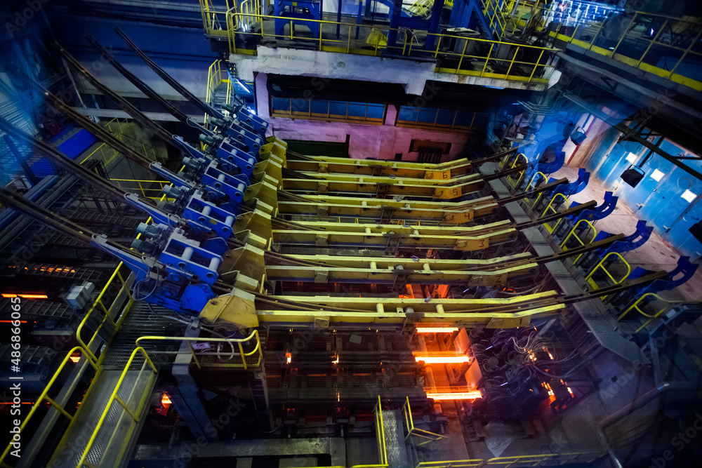 Manufacturing of mild steel square bar. View of continuous casting machine. Manufacturing of mild steel square bar. View of continuous casting machine.