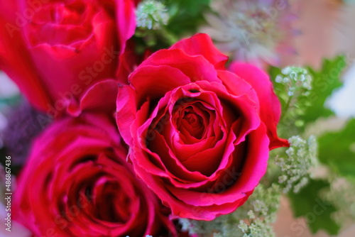 Closeup of a bouquet with red roses.