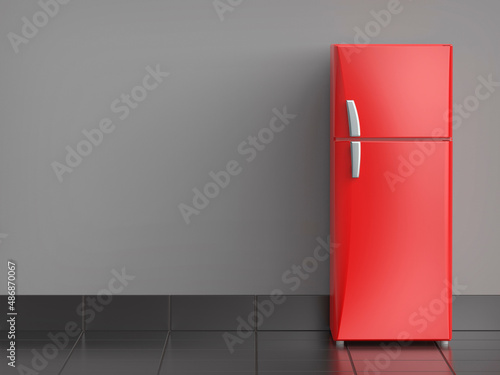 Red refrigerator in the kitchen, front view