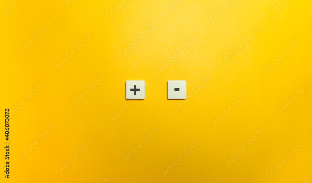 Plus and Minus Sign on Letter Tiles. Plus and Minus Sign on Letter Tiles.