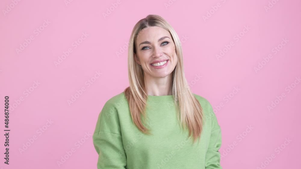 Optimistic lady touch hands shoulders jumper isolated pastel color background Optimistic lady touch hands shoulders jumper isolated pastel color background