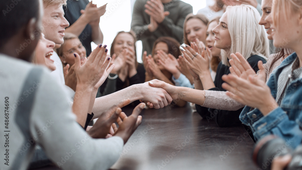 Obraz premium participants of the youth briefing ,shaking hands with each other