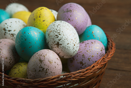 Hand painted pastel colored Easter eggs background. Happy Easter greeting card or invitation.