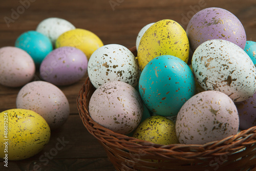 Hand painted pastel colored Easter eggs background. Happy Easter greeting card or invitation.