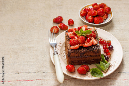 Homemade baking. Chocolate cake with strawberries and mint.