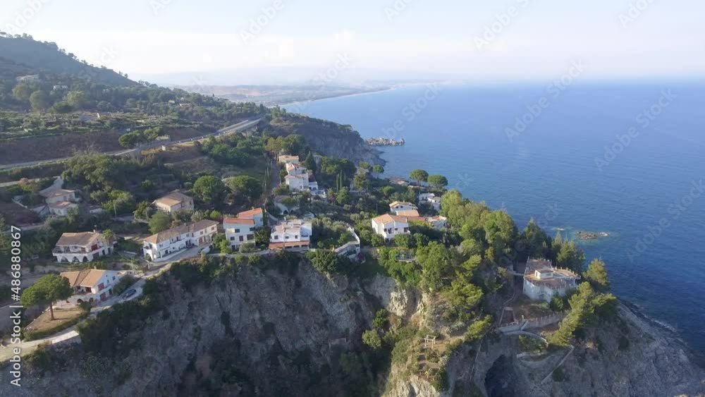 Road, coastline and houses of Calabria, beautiful aerial view in summer season Road, coastline and houses of Calabria, beautiful aerial view in summer season
