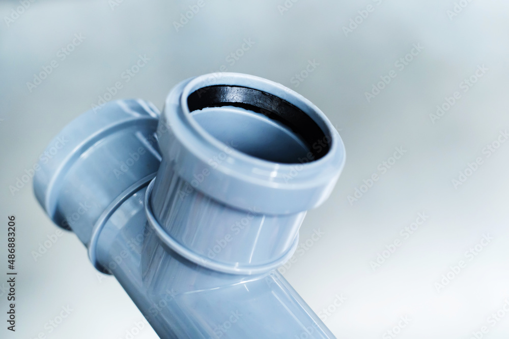 Polypropylene pipe with rubber gasket. A small detail for the installation of a sewer system. Close-up Polypropylene pipe with rubber gasket. A small detail for the installation of a sewer system. Close-up
