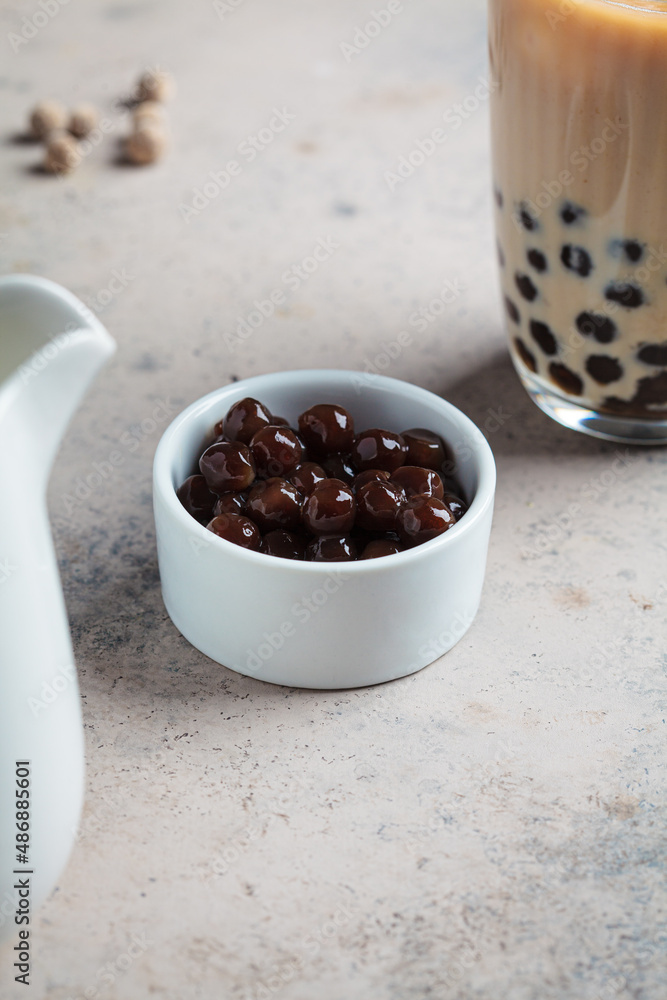 Tapioca pearls in white bowl for cooking bubble tea. Tapioca pearls in white bowl for cooking bubble tea.