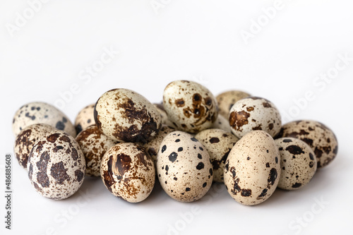 quail eggs on white background. Close-up. The idea of healthy breakfast, symbol of Easter. Copy space