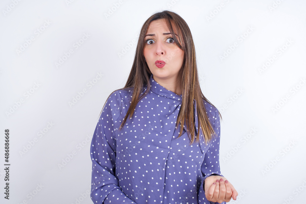 MODEL expressing disgust, unwillingness, disregard having tensive look frowning face, looking indignant with something. MODEL expressing disgust, unwillingness, disregard having tensive look frowning face, looking indignant with something.