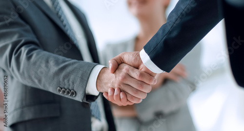 closeup of handshake of business partners photo
