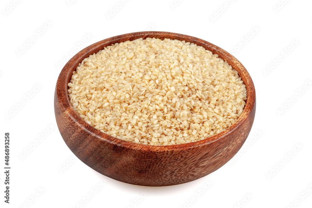 Sesame seeds in a wooden bowl, on a white background Sesame seeds in a wooden bowl, on a white background