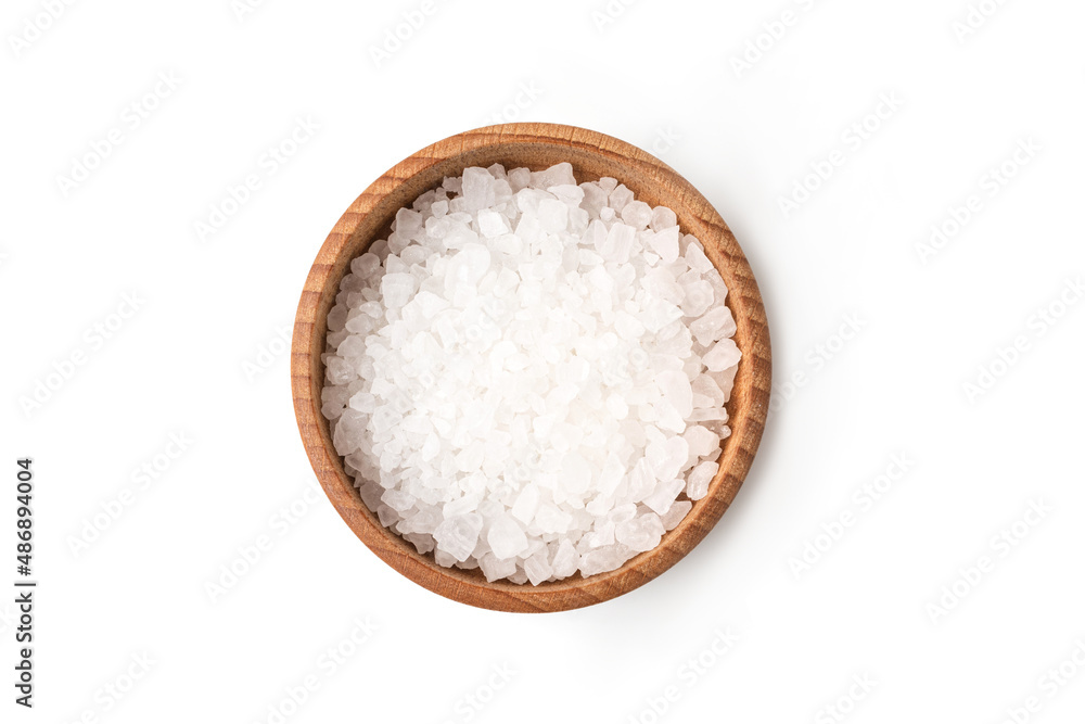 Sea salt in wooden bowl isolated on white background closeup top view Sea salt in wooden bowl isolated on white background closeup top view