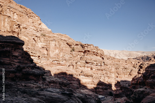 Wallpaper Mural Ruins of the ancient city of Petra in Jordan. Red sandstone mountains on a clear day. Caves in the rock. Landscape. Colorful photos. Torontodigital.ca