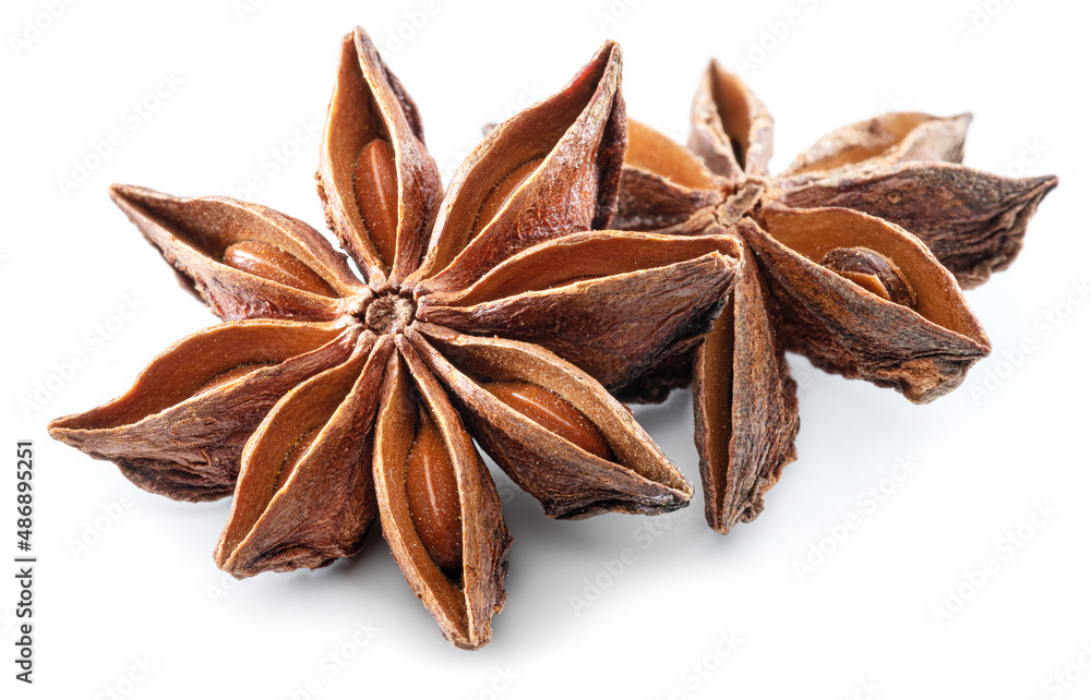 Anise star and aniseeds, spice with strong taste used in cooking, isolated on white background.