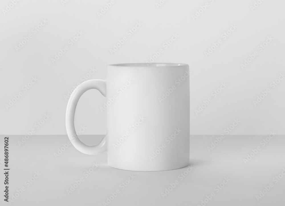 Fototapeta premium Blank ceramic mug on white background. Mockup for design