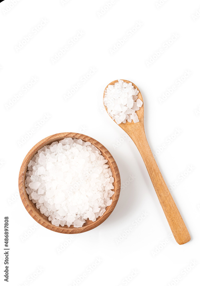Sea salt in wooden bowl isolated on white background closeup top view Sea salt in wooden bowl isolated on white background closeup top view